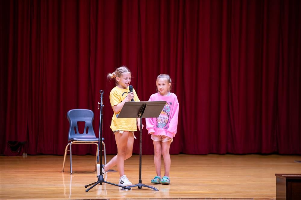  Two students reciting poetry during the recent Poetry Slam event.